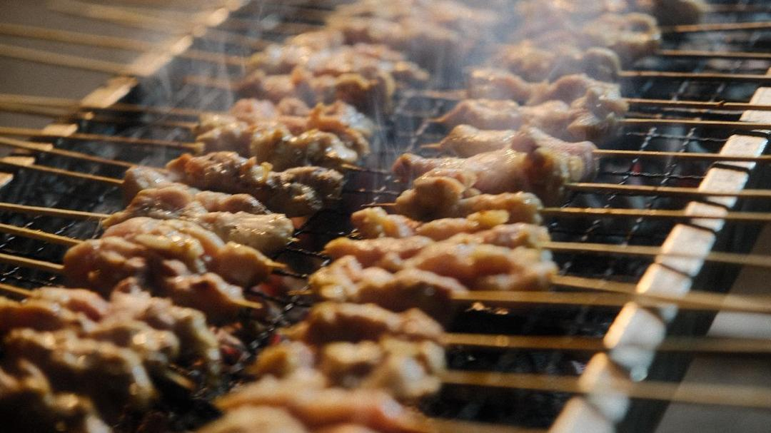 Sate taichan skewers grilling over charcoal